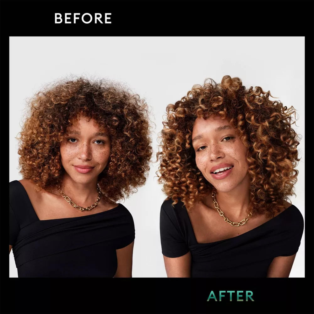 TRESemmé Defining Mousse in use for defined, touchable curls.