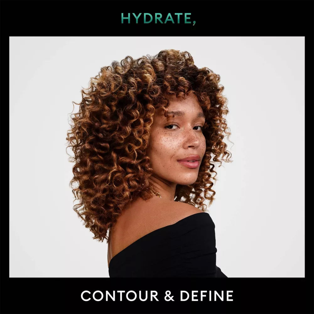 Creamy mousse texture close-up from TRESemmé Defining Mousse showing smoothness.
