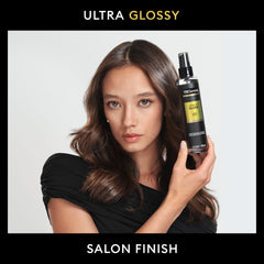 TRESemmé Lamellar Gloss Shine Spray spritz for lightweight styling on damp hair.