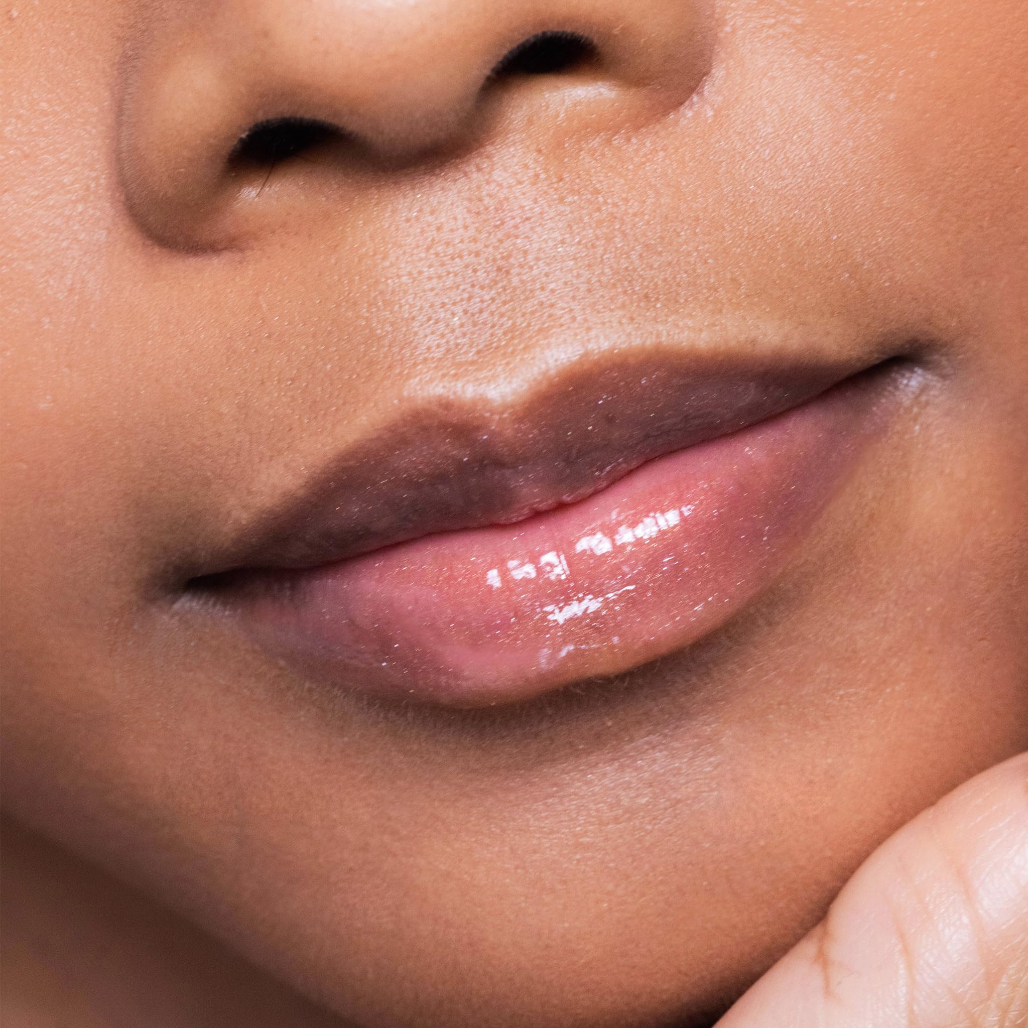 Trish McEvoy Beauty Booster lip gloss layered over shade for amplified color