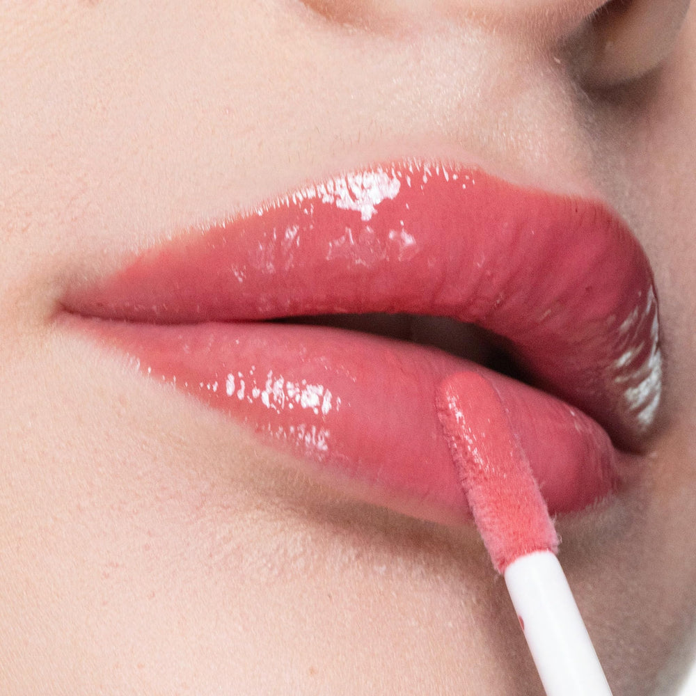 Trish McEvoy Easy Lip Gloss on lips for a shiny, fuller look