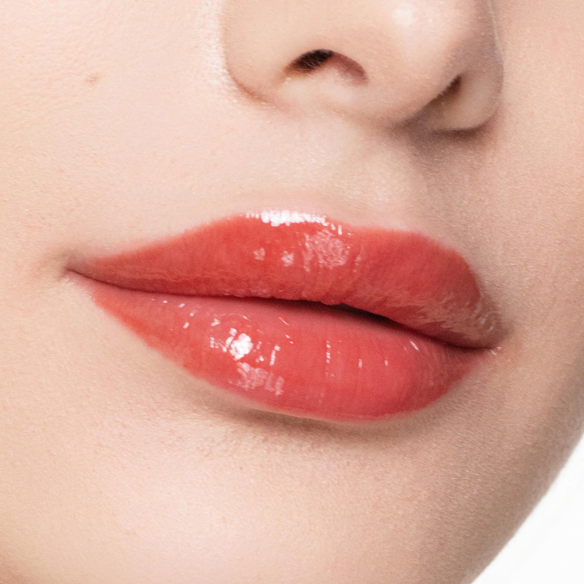 Trish McEvoy Easy Lip Gloss Rendezvous on lips with a glossy, plump look