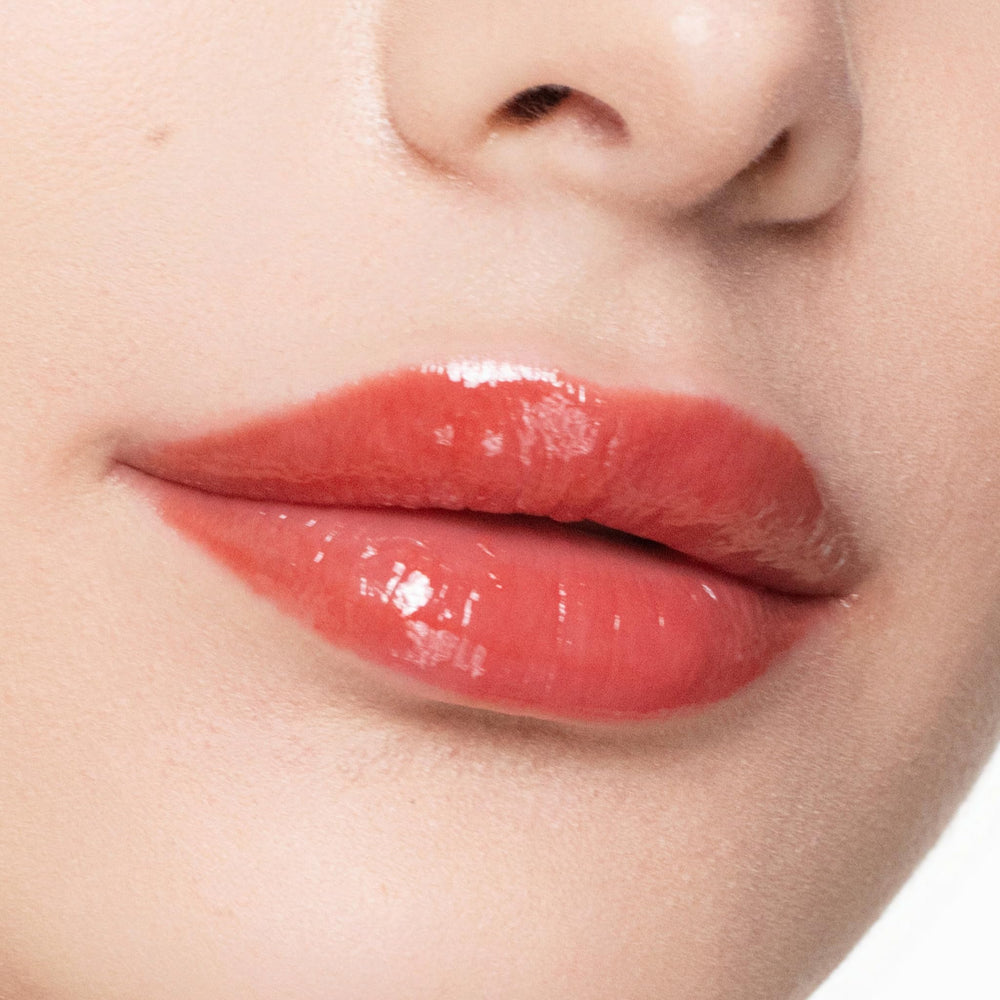 Trish McEvoy Easy Lip Gloss Rendezvous on lips with a glossy, plump look