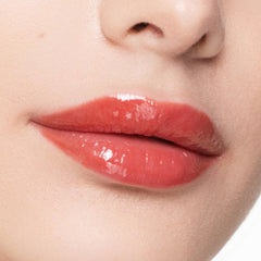 Trish McEvoy Easy Lip Gloss Rendezvous on lips with a glossy, plump look