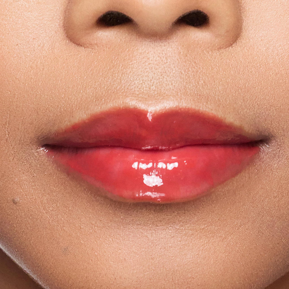 Close-up of Rendezvous gloss highlighting shine and smooth lip texture