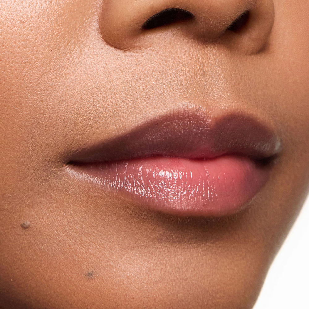 Blotting Trish McEvoy Sheer Lip Color for a balm-like finish