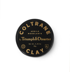 TRIUMPH & DISASTER Coltrane hair clay bottle close-up showing premium packaging and matte finish