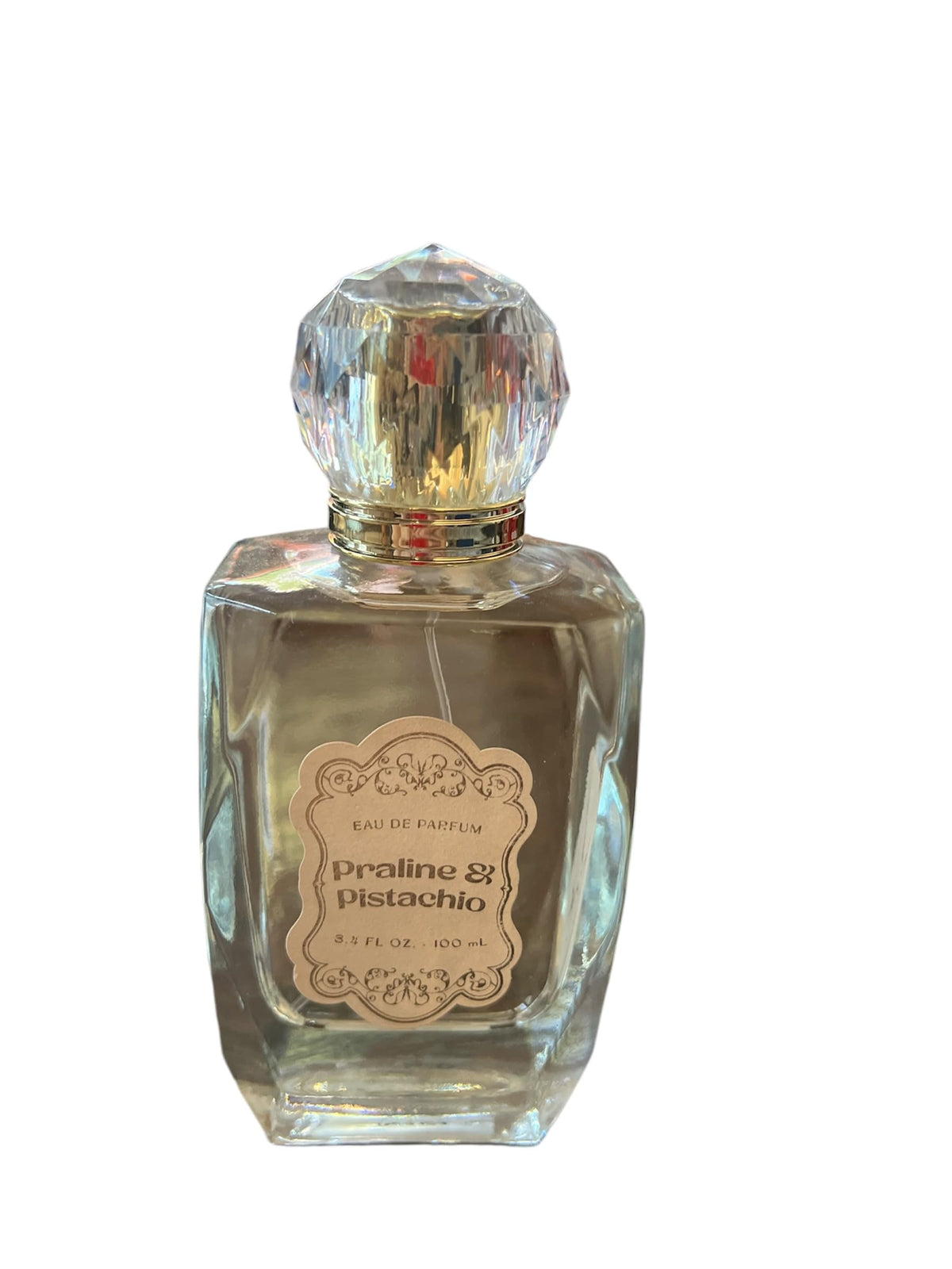 Tru Fragrance Beauty Praline Pistachio bottle showcases creamy woody aroma for unisex wear
