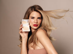 True Luscious Sheer Halo ivory powder with brush demonstrates even application