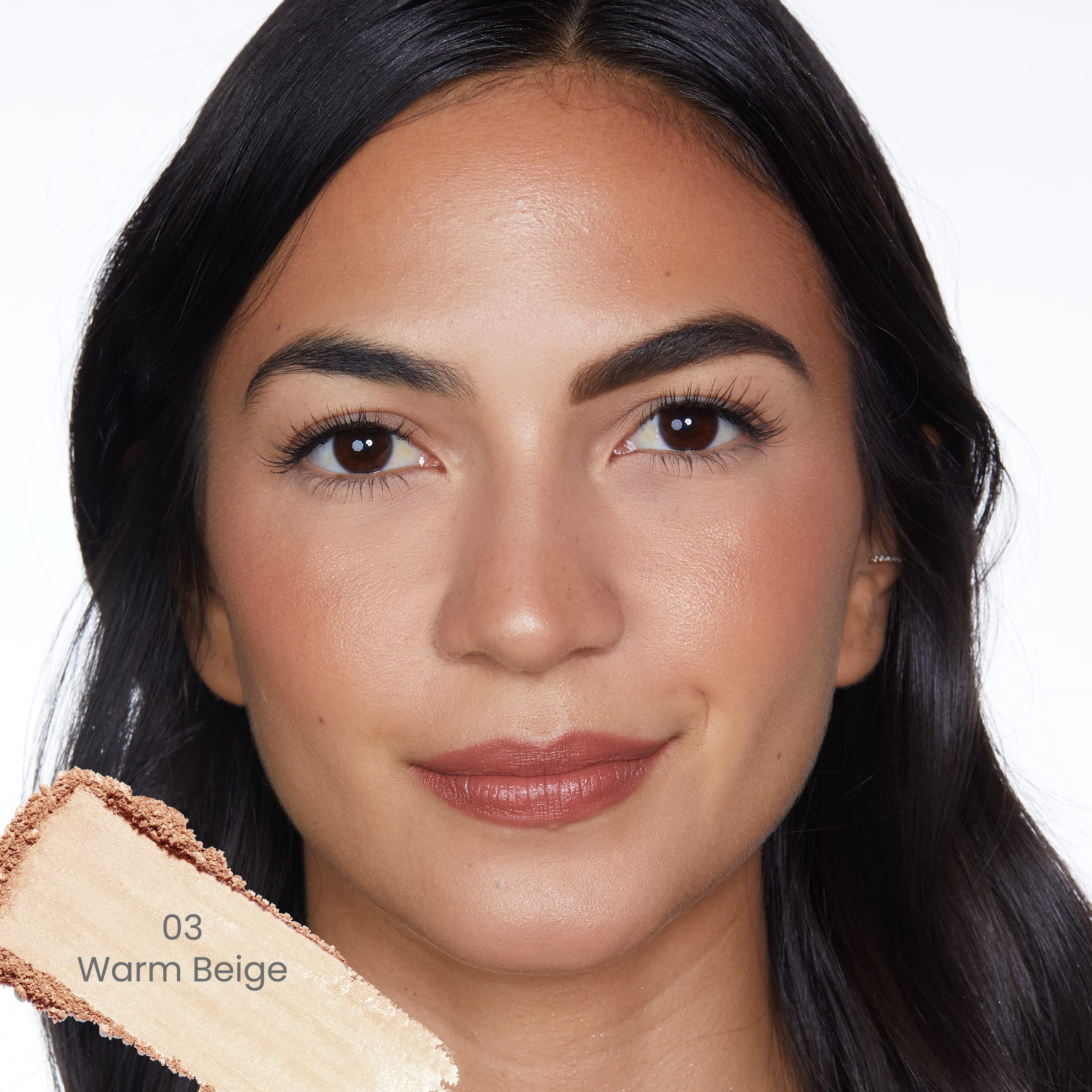 Applying True + Luscious Sheer Halo Powder with brush for even coverage