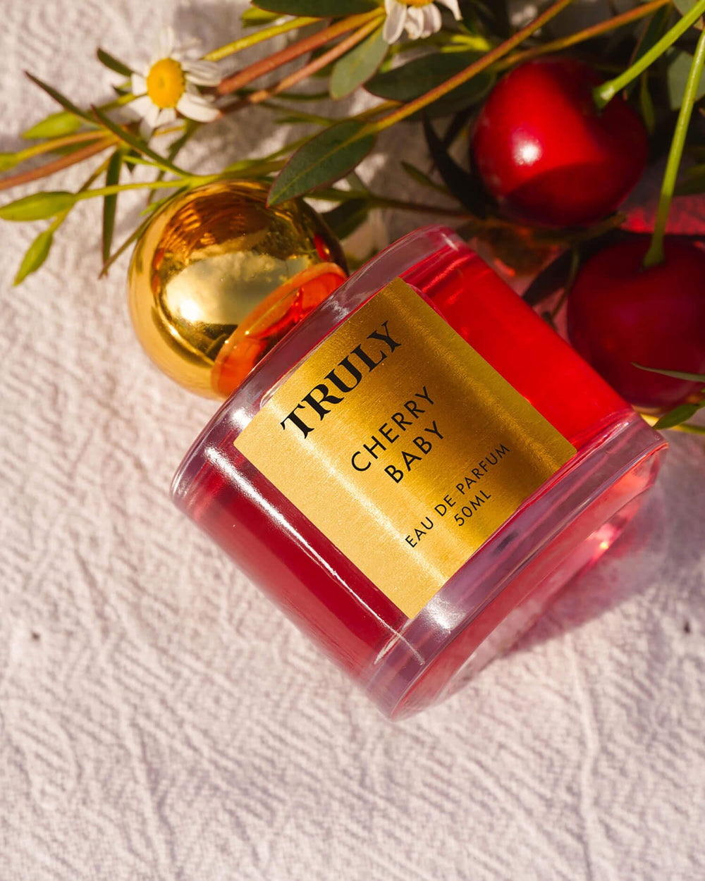 Truly Cherry Baby EDP apply swatch demonstrates light projection for day-to-night wear.