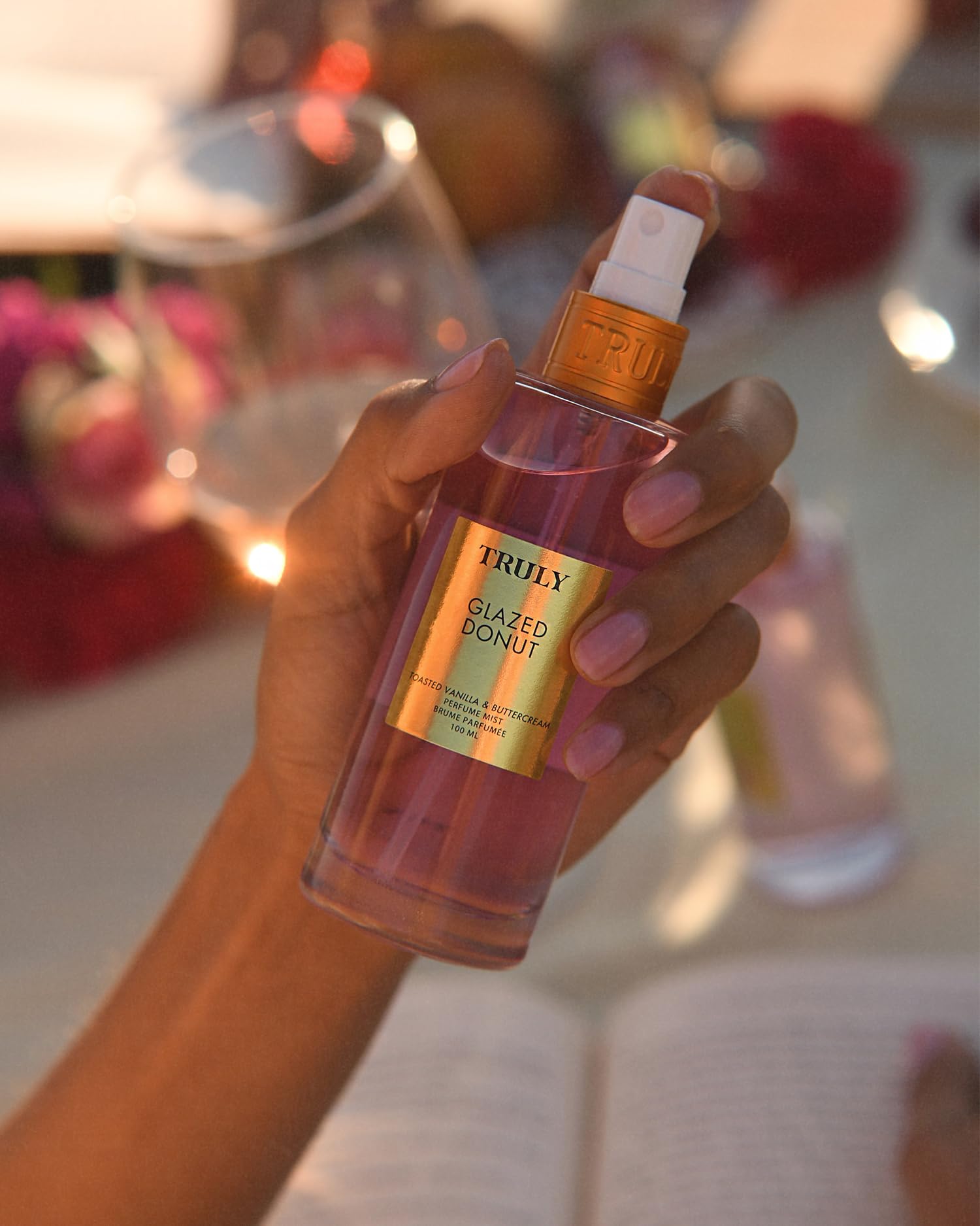 Truly Glazed Donut Perfume Mist bottle on surface, everyday-ready.