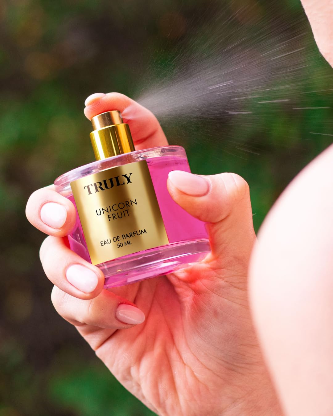 Close-up of spray mist from Truly Unicorn Fruit EDP for light daily wear.