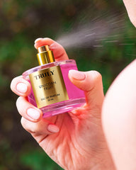 Close-up of spray mist from Truly Unicorn Fruit EDP for light daily wear.