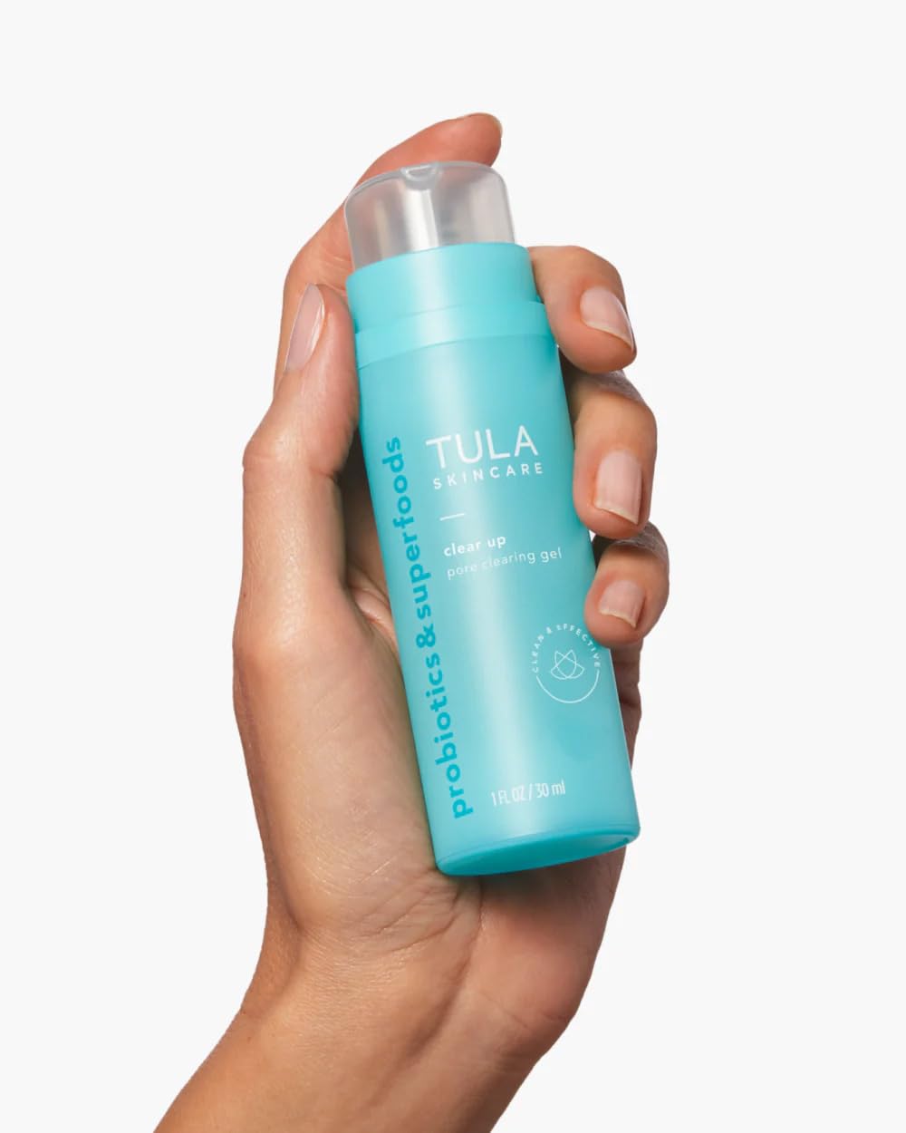 Person applying Clear Up gel as part of a simple skincare routine.