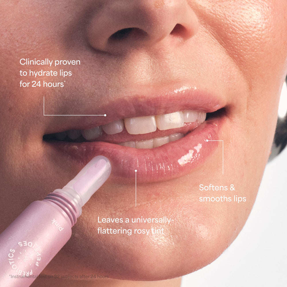 TULA Lip balm swatch showing pink-hint and glossy finish.