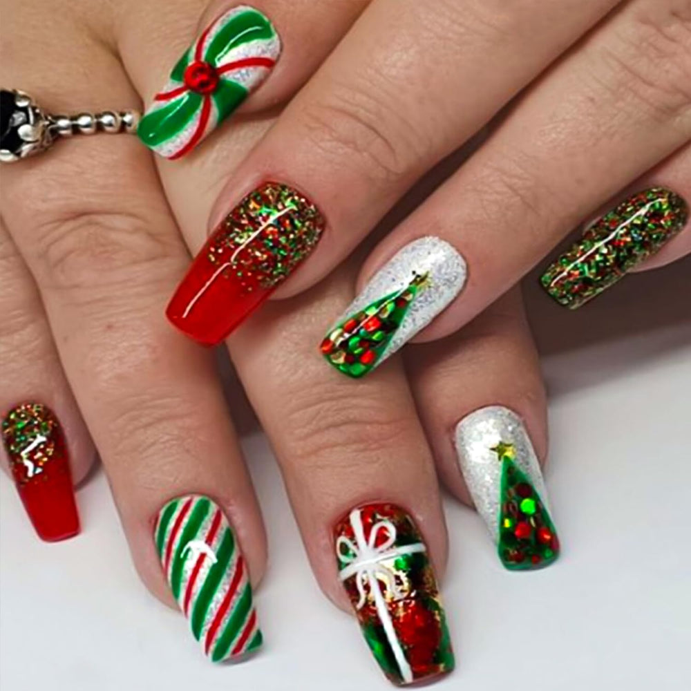 TULOBI Christmas nails with tree design and glitter for a festive look.