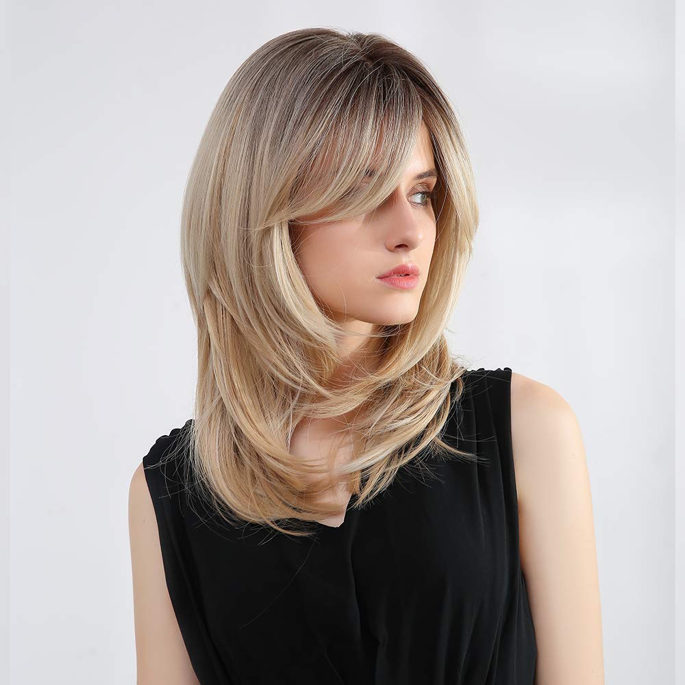 Tumhorn ombre blonde with dark roots for depth and style.