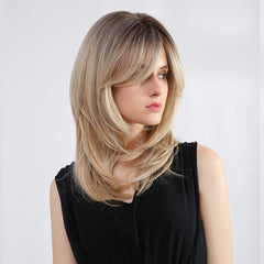 Tumhorn ombre blonde with dark roots for depth and style.