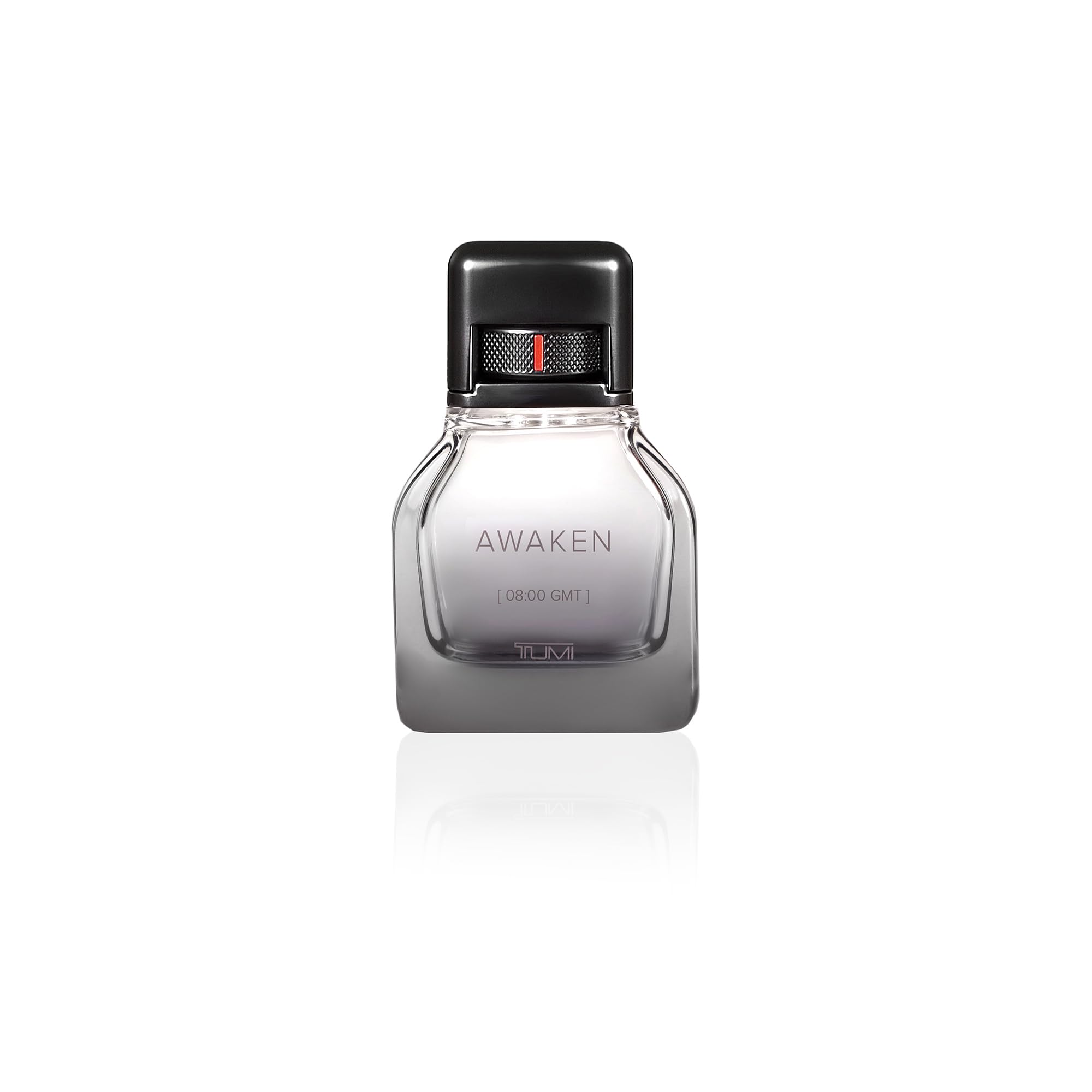 Close-up of TUMI AWAKEN bottle showing woody base notes.