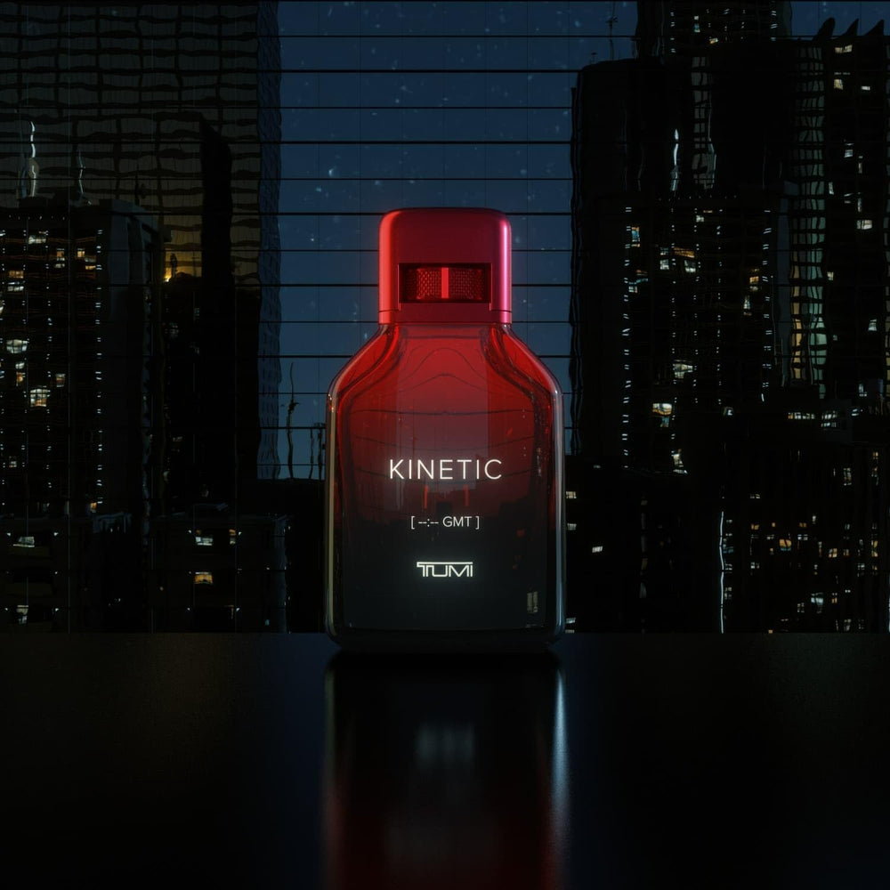 TUMI KINETIC amber-mandarin note close-up highlights warmth.