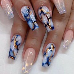 TUZANDW coffin press-on nails with blue marble and sequins for a striking look.