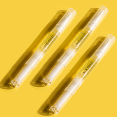 Twinkled T Nail Honey pen application image demonstrating precise cuticle nourishment.