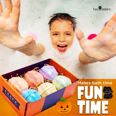 Two Sisters red sherbet scented bath bomb in a playful bath.
