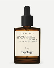 Typology self-tanning serum bottle with clear formula for natural, UV-free color.