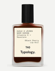 Typology tinted lip oil Black Cherry bottle with nourishing glossy color.