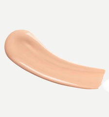 Typology tinted serum being applied with a brush for seamless coverage.