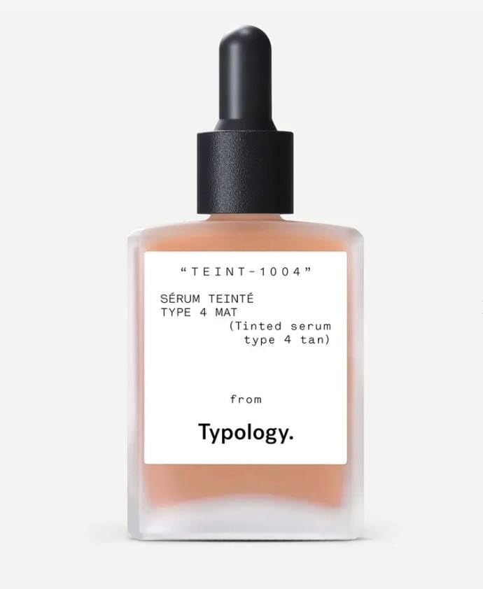 Typology tinted serum bottle for Type 4 tan skin delivering radiance with vitamin C.
