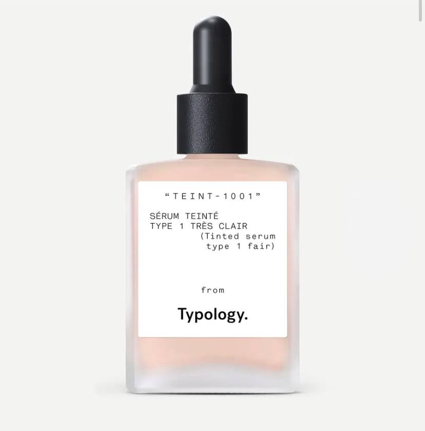 Typology tinted serum bottle with vitamin C for a radiant, natural glow