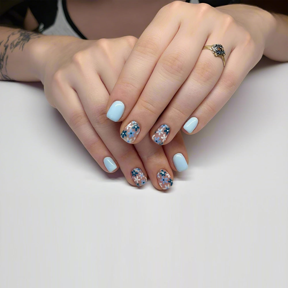 Tyuimhx blue flowers nails pack shows 24 short square tips for flexible sizing.