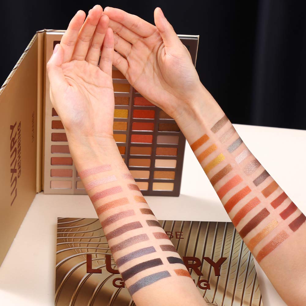 Bronze and burgundy shades highlight depth in a warm, smoky eye look.