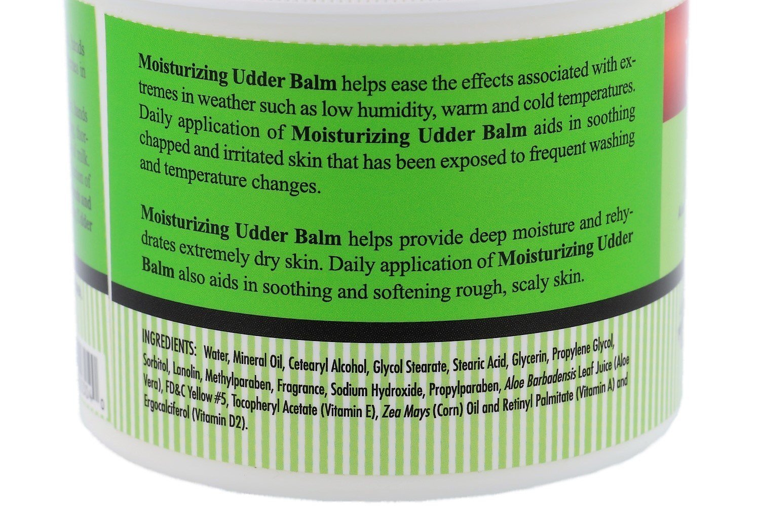 Hands applying The Happy Cow Udder Balm for moisturized skin and protection.
