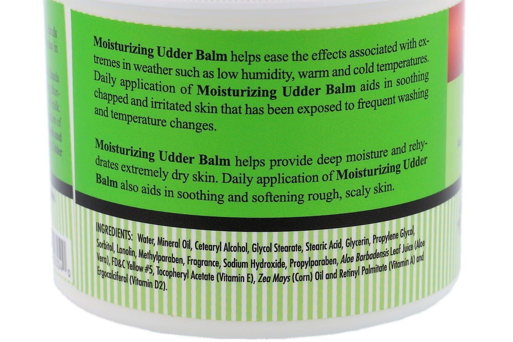 Hands applying The Happy Cow Udder Balm for moisturized skin and protection.