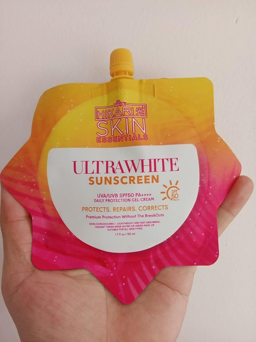 Close-up of UltraFresh Gel-Cream SPF 50 texture showing light absorption.