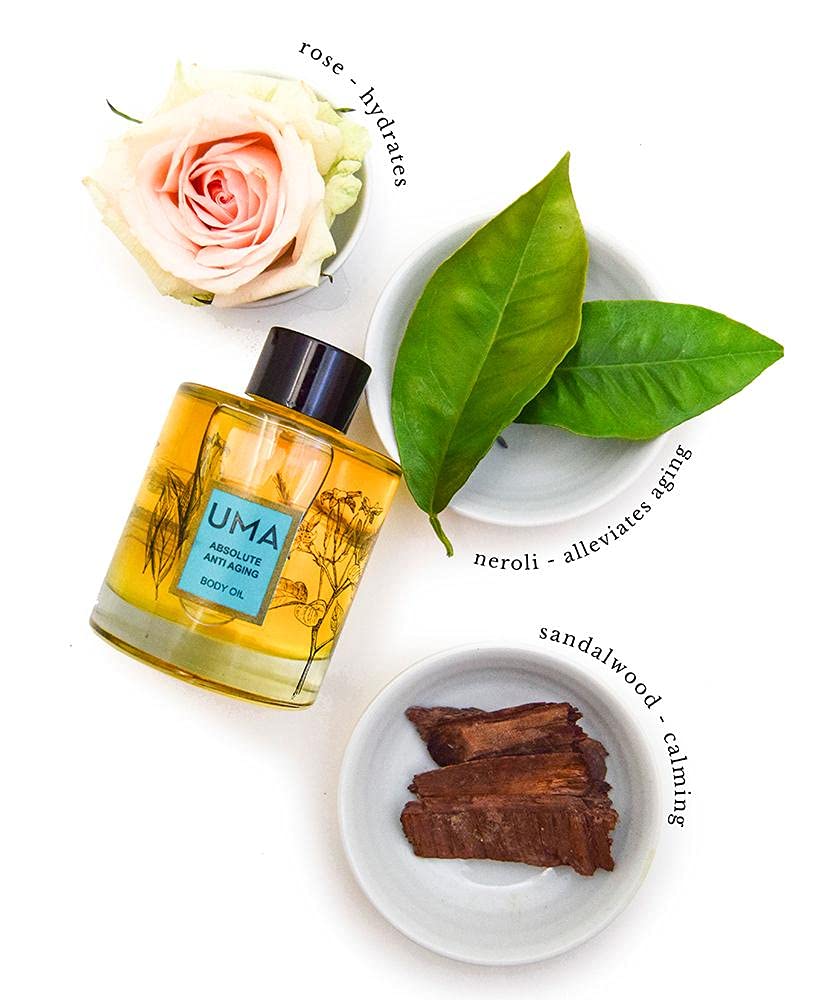 UMA Absolute Anti-Aging Body Oil application on hand, gentle massage for smoother skin.