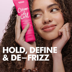 Creamy texture close-up of Umberto Giannini Creme De Curl Control Cream.