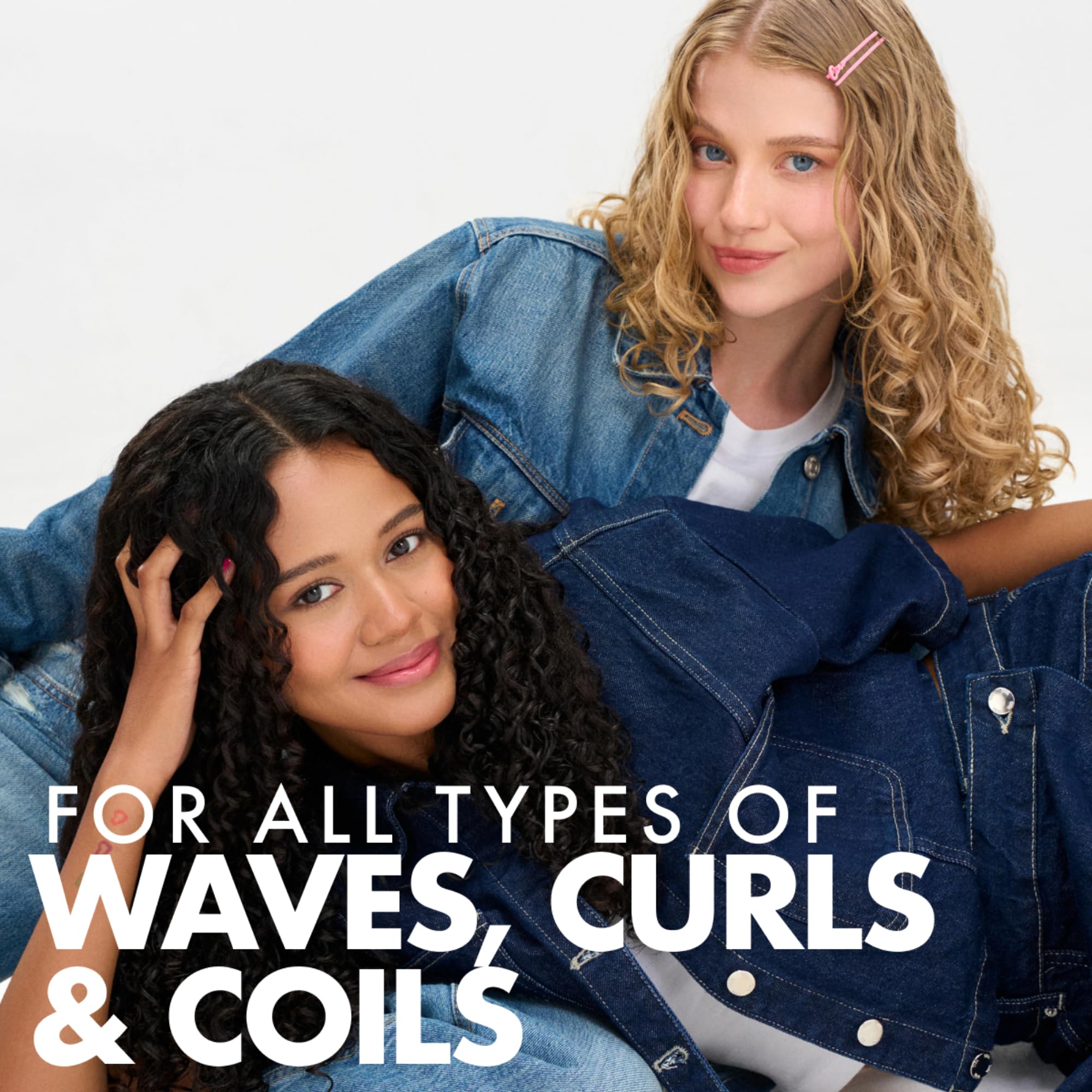 Applying Umberto Giannini Curl Jelly to damp curls for defined waves
