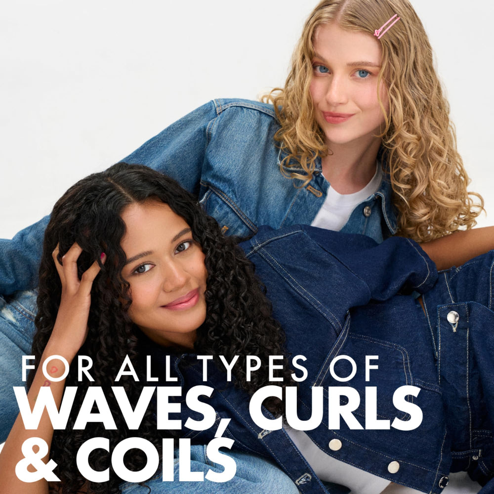 Applying Umberto Giannini Curl Jelly to damp curls for defined waves
