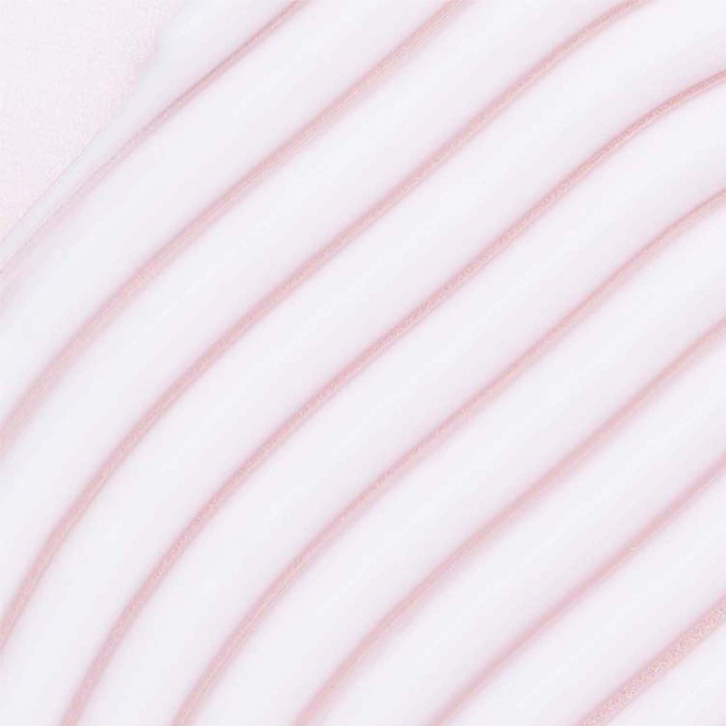 Hands applying Umberto Giannini More Than Moisture Cream to damp hair for smooth, defined twists.