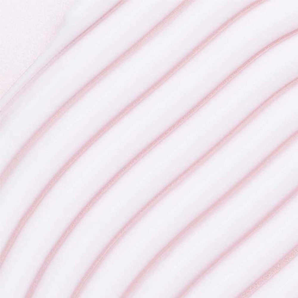 Hands applying Umberto Giannini More Than Moisture Cream to damp hair for smooth, defined twists.