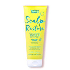 Umberto Giannini Scalp Restore bottle pouring to balance the scalp.