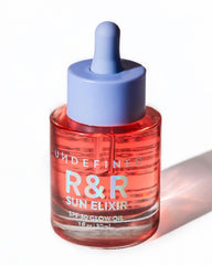Undefined Beauty R&R Sun Elixir bottle closeup with SPF 30 and rose-vanilla scent