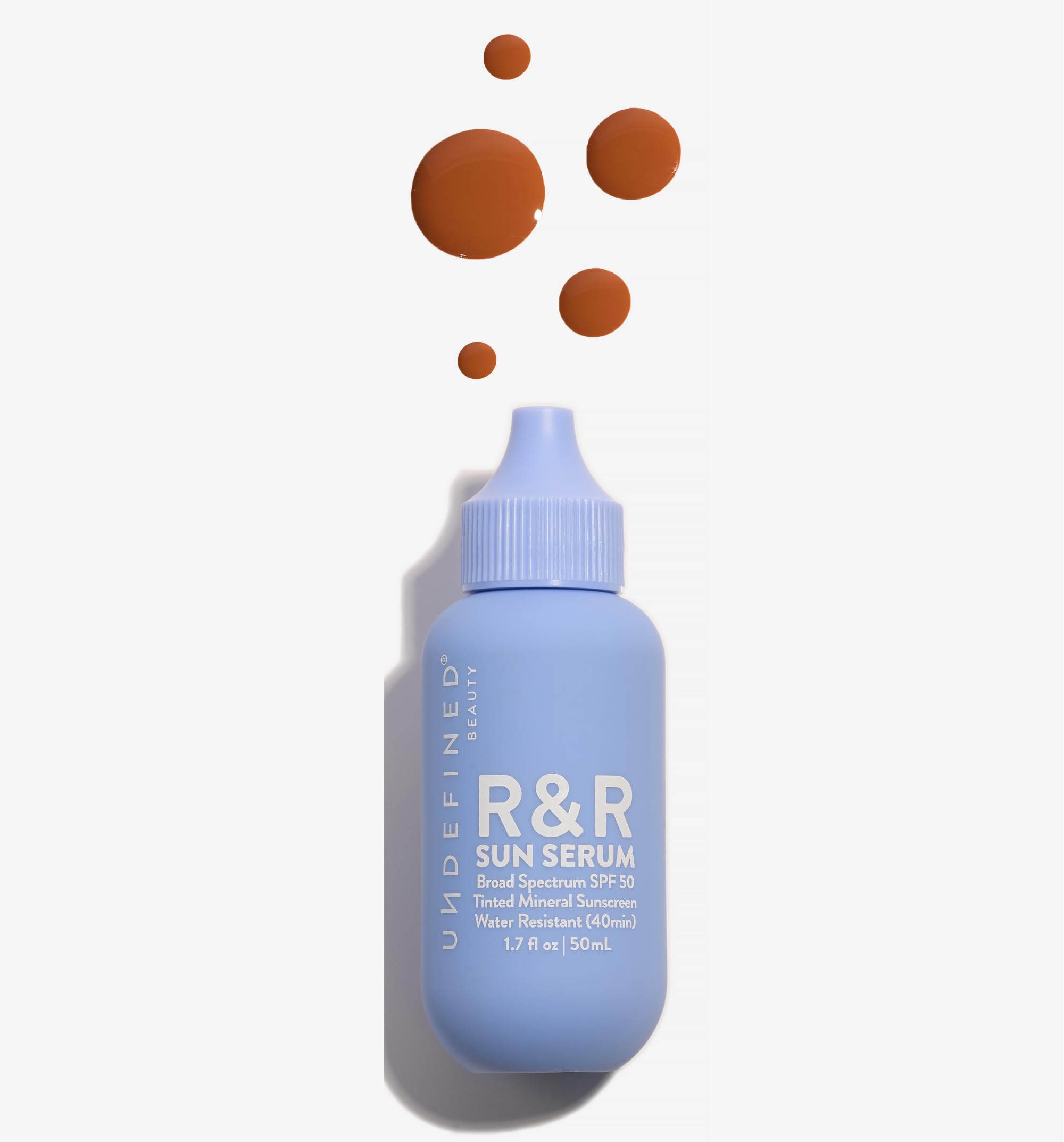 Undefined Beauty R&R Sun Serum Deep Tint bottle delivering daily protection with tinted mineral sunscreen
