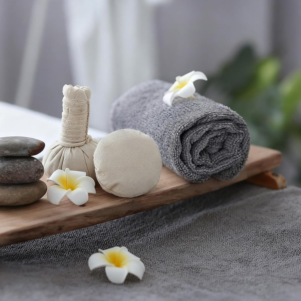 UNIMADE salon towels gray folded on a shelf for home or studio use