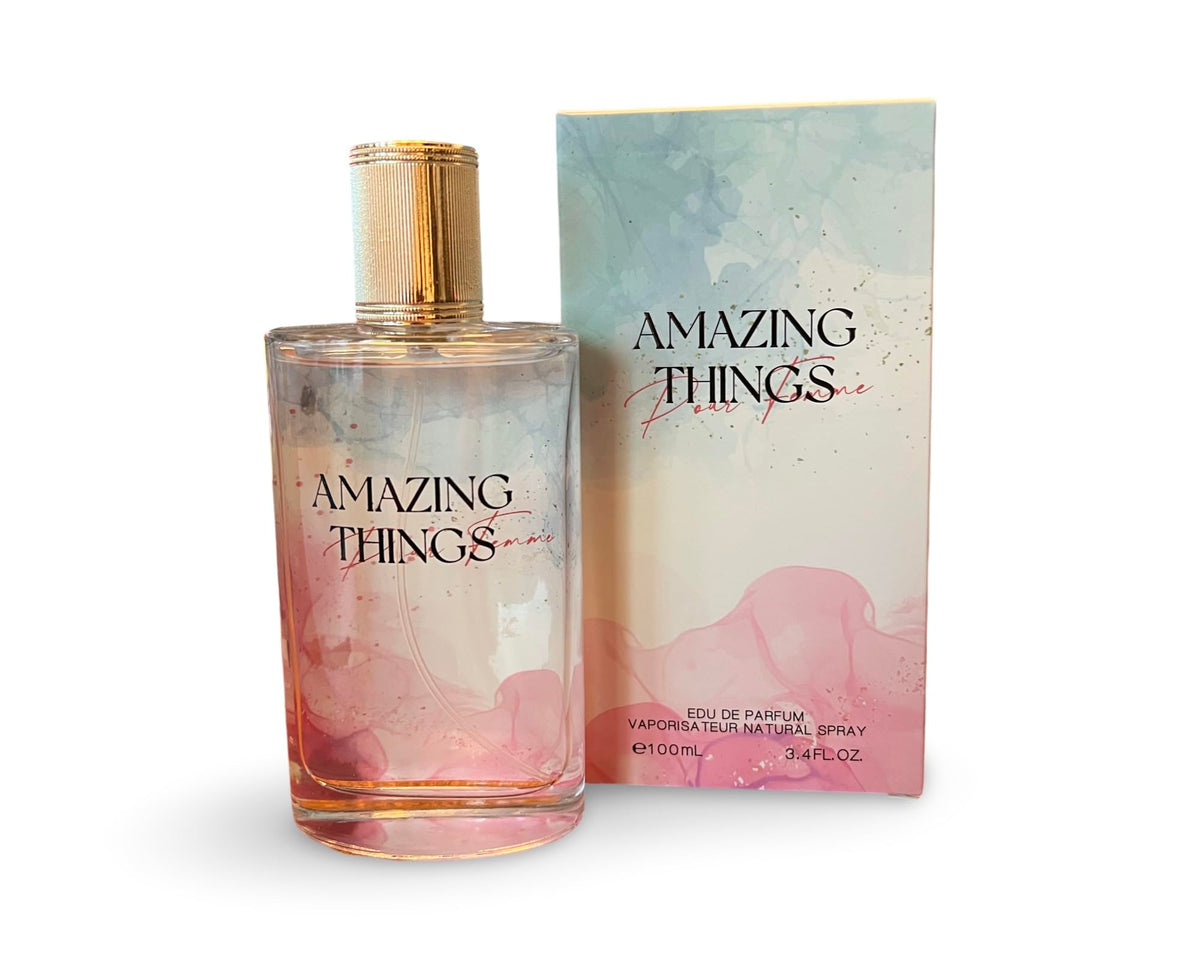 United Scents Amazing Things Pour Femme bottle with watercolor pink-blue design enhances daily elegance.