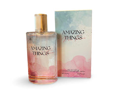 United Scents Amazing Things Pour Femme bottle with watercolor pink-blue design enhances daily elegance.